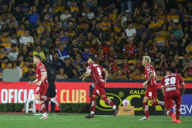 Toluca's Uruguayan forward #16 Federico Vinas (L) celebrates scoring his team's second goal during the Liga MX Apertura tournament football match between Tigres and Toluca at Universitario de la UANL stadium in San Nicolas de los Garza, Nuevo Leon state, Mexico, on October 9, 2026. (Photo by Julio Cesar AGUILAR / AFP)