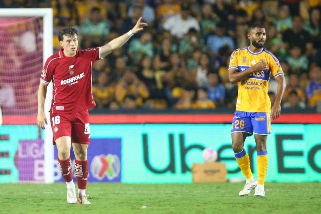 Toluca's Uruguayan forward #16 Federico Vinas (L) celebrates scoring his team's second goal during the Liga MX Apertura tournament football match between Tigres and Toluca at Universitario de la UANL stadium in San Nicolas de los Garza, Nuevo Leon state, Mexico, on October 9, 2026. (Photo by Julio Cesar AGUILAR / AFP)