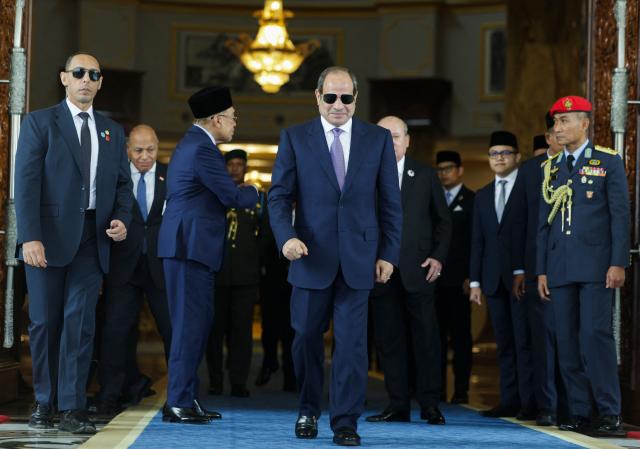 Egypt's President Abdel Fattah al-Sisi walks during his state visit at the National Palace in Kuala Lumpur on October 10, 2026. (Photo by Hasnoor Hussain / POOL / AFP)