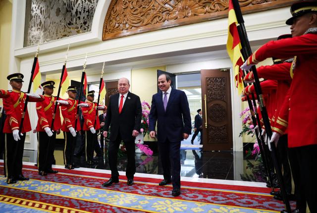 Egypt's President Abdel Fattah al-Sisi (centre R) walks with Malaysia's King Sultan Ibrahim during al-Sisi's state visit at the National Palace in Kuala Lumpur on October 10, 2026. (Photo by Hasnoor Hussain / POOL / AFP)