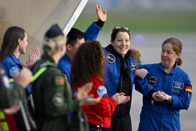 European Space Agency (ESA) French astronaut Sophie Adenot (2nd R) arrives at the Military Airport in Cologne on October 10, 2026, the day after she and three colleagues splashed down in the Pacific Ocean returning from their mission at the International Space Station (ISS). Sophie Adenot became the first French female astronaut to venture outside the International Space Station (ISS) for a spacewalk in late August 2026. (Photo by INA FASSBENDER / AFP)
