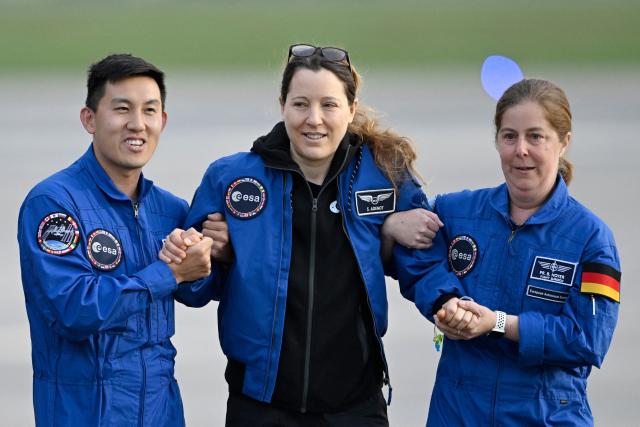 European Space Agency (ESA) French astronaut Sophie Adenot (C) arrives at the Military Airport in Cologne on October 10, 2026, the day after she and three colleagues splashed down in the Pacific Ocean returning from their mission at the International Space Station (ISS). Sophie Adenot became the first French female astronaut to venture outside the International Space Station (ISS) for a spacewalk in late August 2026. (Photo by INA FASSBENDER / AFP)