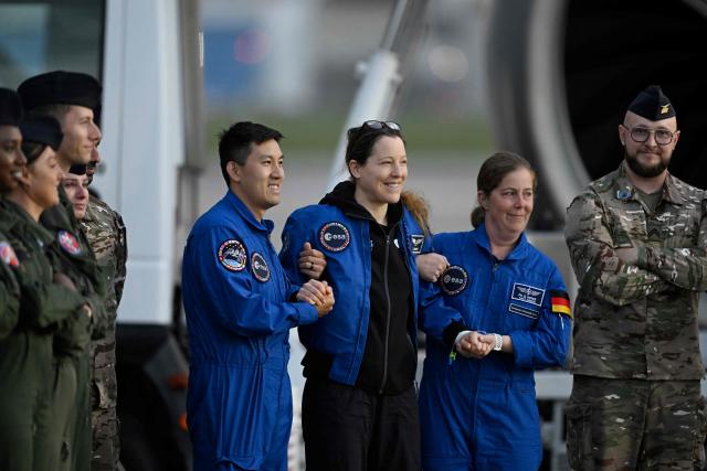 European Space Agency (ESA) French astronaut Sophie Adenot (C) arrives at the Military Airport in Cologne on October 10, 2026, the day after she and three colleagues splashed down in the Pacific Ocean returning from their mission at the International Space Station (ISS). Sophie Adenot became the first French female astronaut to venture outside the International Space Station (ISS) for a spacewalk in late August 2026. (Photo by INA FASSBENDER / AFP)