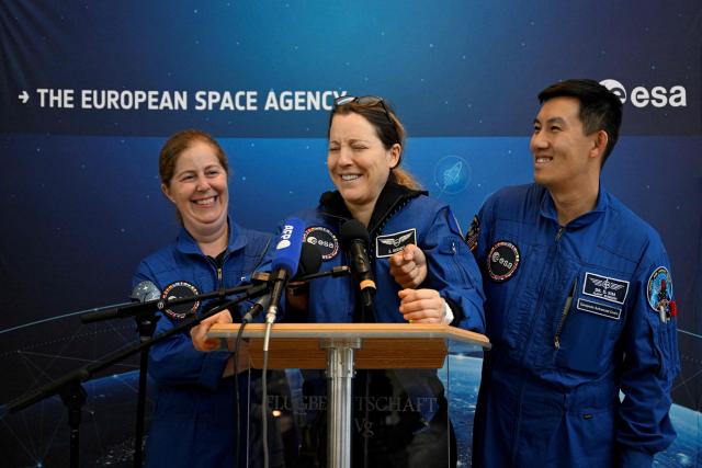 European Space Agency (ESA) French astronaut Sophie Adenot (C) reacts as she delivers a speech following her arrival at the Military Airport in Cologne on October 10, 2026, the day after she and three colleagues splashed down in the Pacific Ocean returning from their mission at the International Space Station (ISS). Sophie Adenot became the first French female astronaut to venture outside the International Space Station (ISS) for a spacewalk in late August 2026. (Photo by INA FASSBENDER / AFP)