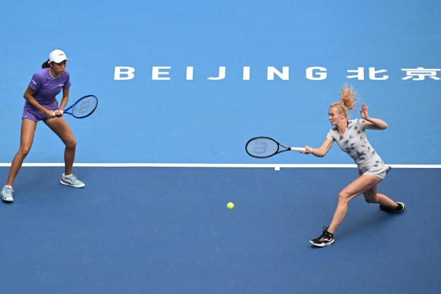 Czech Republic's Katerina Siniakova (R) and China's Zhang Shuai play a point against New Zealand's Erin Routliffe and Indonesia's Aldila Sutjiadi during their women's doubles semi-final match at the China Open tennis tournament in Beijing on October 10, 2026. (Photo by ADEK BERRY / AFP)