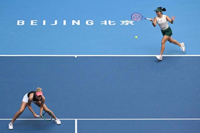 Indonesia's Aldila Sutjiadi (R) and New Zealand's Erin Routliffe play a point against Czech Republic's Katerina Siniakova and China's Zhang Shuai during their women's doubles semi-final match at the China Open tennis tournament in Beijing on October 10, 2026. (Photo by Adek BERRY / AFP)