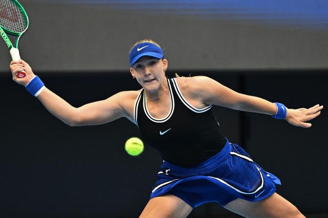 Russia’s Mirra Andreeva hits a return to Czech Republic's Nikola Bartunkova during their women’s singles semi-final at the China Open tennis tournament in Beijing on October 10, 2026. (Photo by Pedro PARDO / AFP)