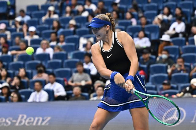 Russia’s Mirra Andreeva hits a return to Czech Republic's Nikola Bartunkova during their women’s singles semi-final at the China Open tennis tournament in Beijing on October 10, 2026. (Photo by Pedro PARDO / AFP)