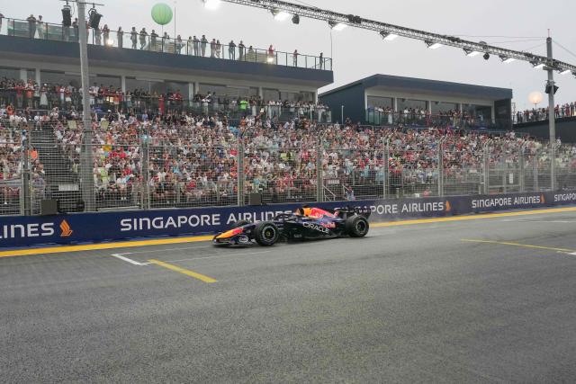 Red Bull Racing's Dutch driver Max Verstappen drives during the sprint race ahead of the Formula One Singapore Grand Prix at the Marina Bay Street Circuit in Singapore on October 10, 2026. (Photo by Ng Han Guan / POOL / AFP)