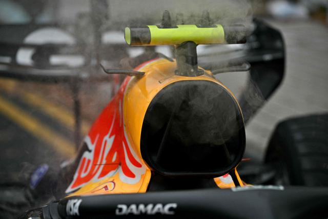 Red Bull Racing's French driver Isack Hadjar's car is extracted from track during the sprint race ahead of the Formula One Singapore Grand Prix at the Marina Bay Street Circuit in Singapore on October 10, 2026. (Photo by ANTHONY WALLACE / AFP)