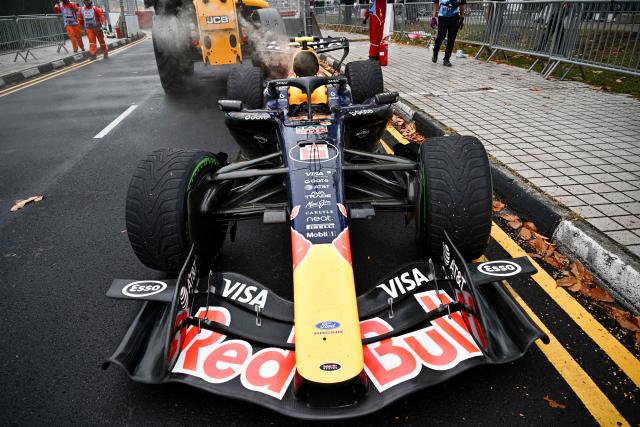 Red Bull Racing's French driver Isack Hadjar is extracted from track during the sprint race ahead of the Formula One Singapore Grand Prix at the Marina Bay Street Circuit in Singapore on October 10, 2026. (Photo by ANTHONY WALLACE / AFP)