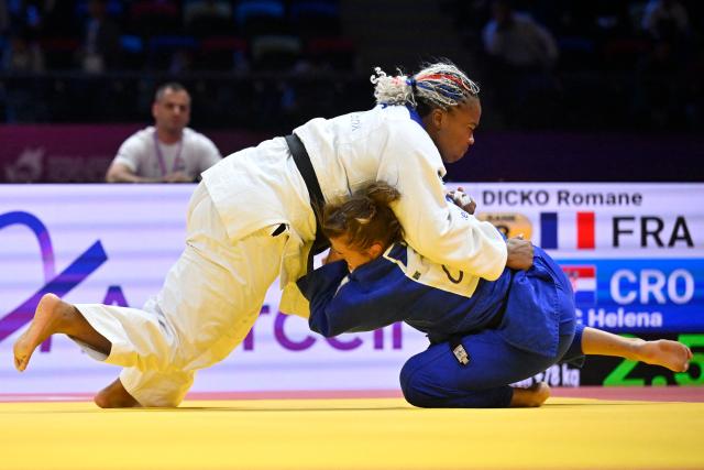 France's Romane Dicko (white) competes against Croatia's Helena Vukovic in the women's over 78 kg quarter-final at the World Judo Championships in Baku on October 10, 2026. (Photo by Alexander NEMENOV / AFP)