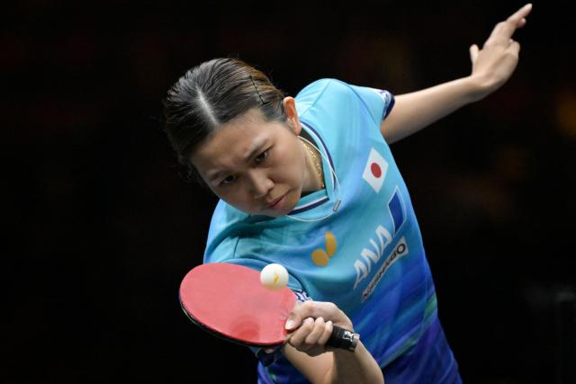 Japan's Hitomi Sato hits a return to China's Chen Xingtong during their women's table tennis singles semifinal match at the China Smash Table Tennis 2026 tournament in Beijing on October 10, 2026. (Photo by WANG Zhao / AFP)