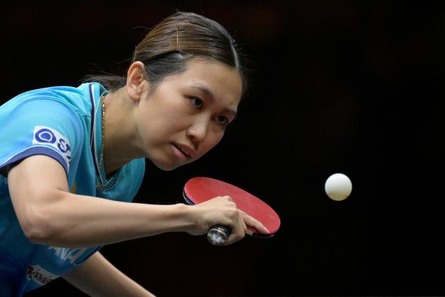 Japan's Hitomi Sato hits a return to China's Chen Xingtong during their women's table tennis singles semifinal match at the China Smash Table Tennis 2026 tournament in Beijing on October 10, 2026. (Photo by WANG Zhao / AFP)