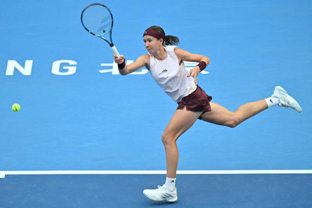 Czech Republic’s Nikola Bartunkova hits a return to Russia’s Mirra Andreeva during their women’s singles semi-final match at the China Open tennis tournament in Beijing on October 10, 2026. (Photo by Adek BERRY / AFP)