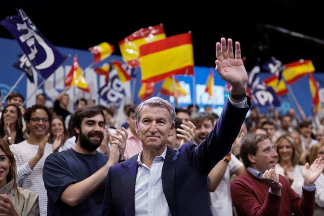 Spain's opposition Partido Popular (PP) party's leader Alberto Nunez Feijoo waves as he arrives to a campaign rally in Madrid on October 10, 2026. Spain's Prime Minister called a snap election for November 29, after parliament rejected housing relief measures proposed by his minority government amid nationwide protests. The defeat was just the latest political setback for one of the few left-leaning government leaders still in power in Europe. (Photo by Oscar DEL POZO / AFP)