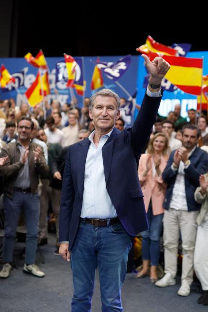 Spain's opposition Partido Popular (PP) party's leader Alberto Nunez Feijoo gestures during a campaign rally in Madrid on October 10, 2026. Spain's Prime Minister called a snap election for November 29, after parliament rejected housing relief measures proposed by his minority government amid nationwide protests. The defeat was just the latest political setback for one of the few left-leaning government leaders still in power in Europe. (Photo by Oscar DEL POZO / AFP)