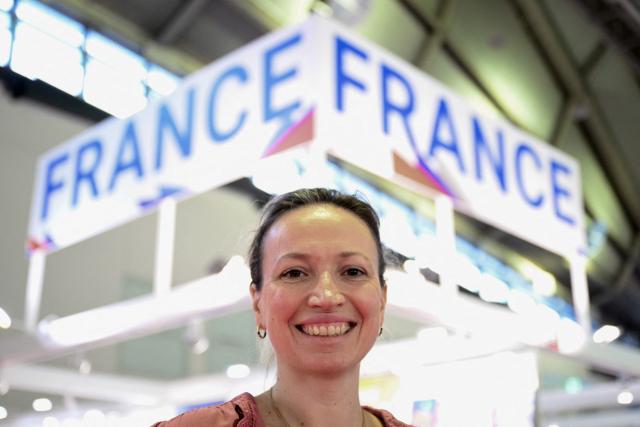 Charlotte Allibert, co-founder of Librinova, a self-publishing company and literary agency, poses for a photo at the Frankfurt Book Fair in Frankfurt am Main, western Germany, on October 8, 2026. From October 7 to 11, 2026, publishing experts will meet up with partners from the technology and creative industries such as film and games at one of the world’s leading venues for printed and digital content with the Czech republic as guest of honour. (Photo by Kirill KUDRYAVTSEV / AFP)