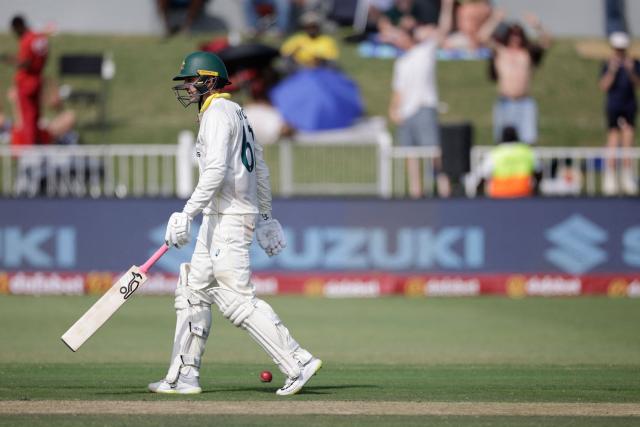 Australia's Nathan Lyon walks back to the pavilion after his dismissal by South Africa's Marco Jansen on day two of the first Test match between South Africa and Australia at the Kingsmead stadium in Durban on October 10, 2026. (Photo by Marco Longari / AFP)