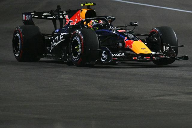 Red Bull Racing's French driver Isack Hadjar drives during the qualifying session ahead of the Formula One Singapore Grand Prix at the Marina Bay Street Circuit in Singapore on October 10, 2026. (Photo by ANTHONY WALLACE / AFP)