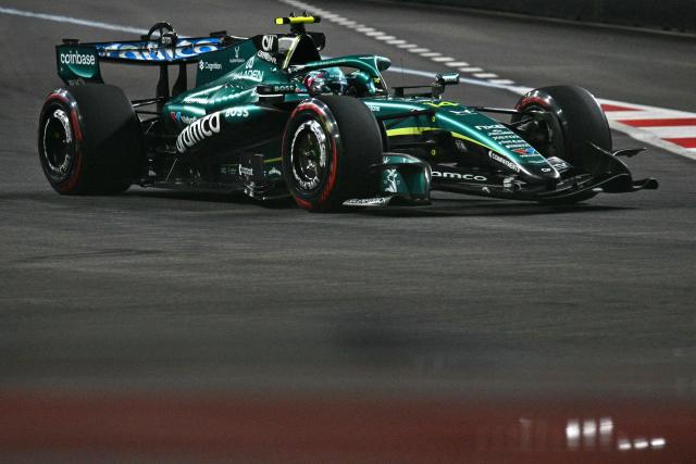 Aston Martin's Spanish driver Fernando Alonso drives during the qualifying session ahead of the Formula One Singapore Grand Prix at the Marina Bay Street Circuit in Singapore on October 10, 2026. (Photo by ANTHONY WALLACE / AFP)