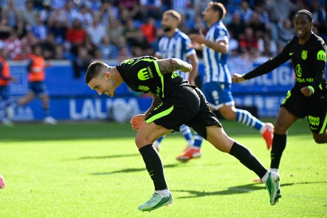 Atletico Madrid's Spanish defender #22 Alejandro Grimaldo heads in to score his team's first goal during the Spanish league football match between Deportivo Alaves and Club Atletico de Madrid at Mendizorroza Stadium in Vitoria on October 10, 2026. (Photo by ANDER GILLENEA / AFP)