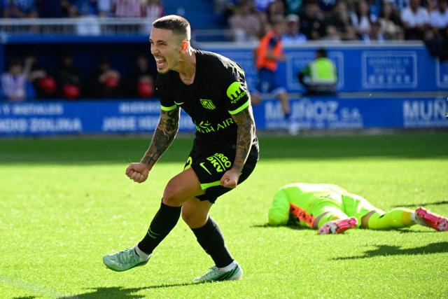 Atletico Madrid's Spanish defender #22 Alejandro Grimaldo celebrates scoring his team's first goal during the Spanish league football match between Deportivo Alaves and Club Atletico de Madrid at Mendizorroza Stadium in Vitoria on October 10, 2026. (Photo by ANDER GILLENEA / AFP)