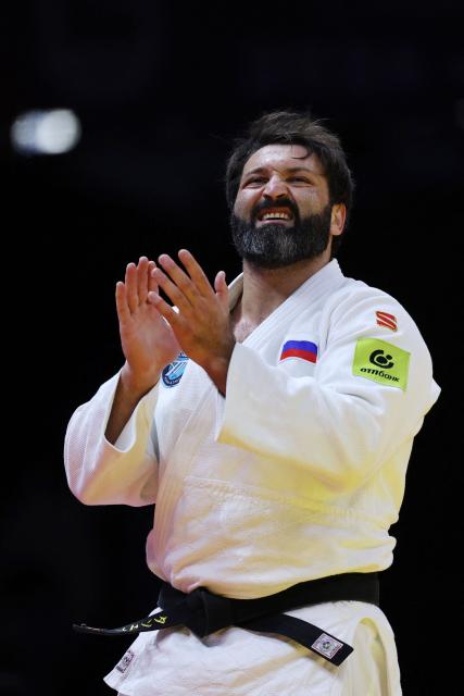 Russia's Inal Tasoev reacts after winning the men's over 100 kg gold medal bout at the World Judo Championships in Baku on October 10, 2026. (Photo by Anne-Christine POUJOULAT / AFP)