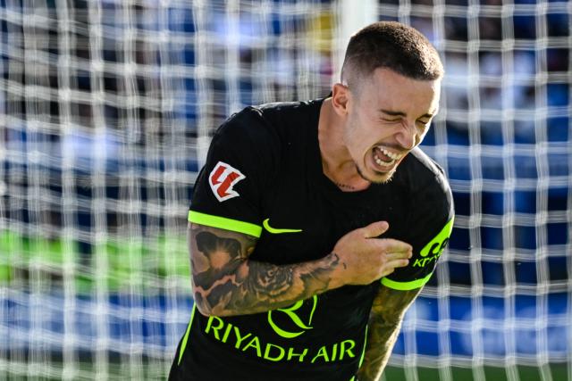 Atletico Madrid's Spanish defender #22 Alejandro Grimaldo celebrates scoring his team's first goal during the Spanish league football match between Deportivo Alaves and Club Atletico de Madrid at Mendizorroza Stadium in Vitoria on October 10, 2026. (Photo by ANDER GILLENEA / AFP)