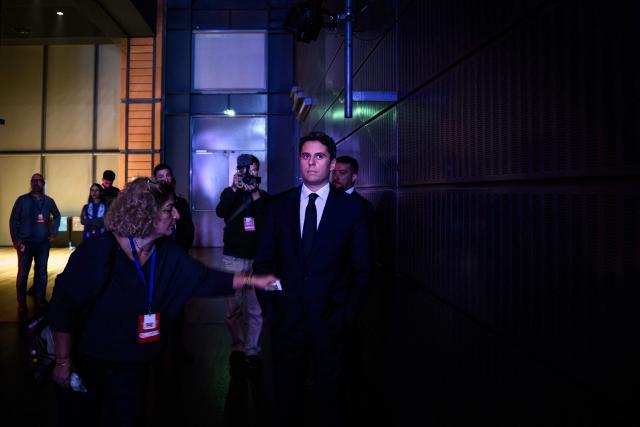 Centre-right party Renaissance candidate in France's 2027 presidential election Gabriel Attal waits before making his entrance during a campaign rally in Lyon on October 10, 2026. (Photo by JEFF PACHOUD / AFP)