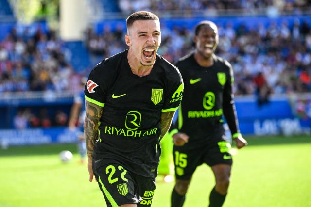 Atletico Madrid's Spanish defender #22 Alejandro Grimaldo celebrates scoring his team's first goal during the Spanish league football match between Deportivo Alaves and Club Atletico de Madrid at Mendizorroza Stadium in Vitoria on October 10, 2026. (Photo by ANDER GILLENEA / AFP)