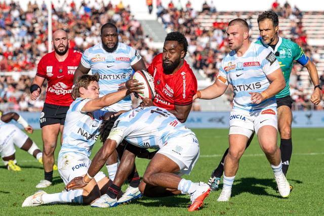 Toulon's Fijian wing Setariki Tuicuvu (C) attempts to break away during the French Top 14 rugby union match between RC Toulon and Racing 92 at the Stade Mayol in Toulon, on October 10, 2026. (Photo by Miguel MEDINA / AFP)