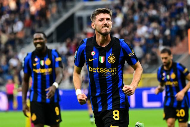 Inter Milan's Croatian midfielder #8 Petar Sucic celebrates scoring his team's first goal during the Italian Serie A football match between Inter Milan and Parma at the San Siro Stadium in Milan, on October 10, 2026. (Photo by Piero CRUCIATTI / AFP)