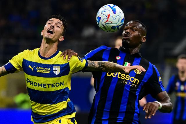 Parma’s Italian defender #15 Enrico Delprato fights for the ball with Inter milan's French forward #14 Ange-Yoan Bonny (R) during the Italian Serie A football match between Inter Milan and Parma at the San Siro Stadium in Milan, on October 10, 2026. (Photo by Piero CRUCIATTI / AFP)