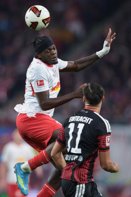 Leipzig's French defender #23 Castello Lukeba and Frankfurt's German forward #11 Younes Ebnoutalib vie for the ball during the German first divison Bundesliga football match between RB Leipzig and Eintracht Frankfurt in Leipzig, eastern Germany on October 10, 2026. (Photo by Ronny HARTMANN / AFP) / DFL REGULATIONS PROHIBIT ANY USE OF PHOTOGRAPHS AS IMAGE SEQUENCES AND/OR QUASI-VIDEO