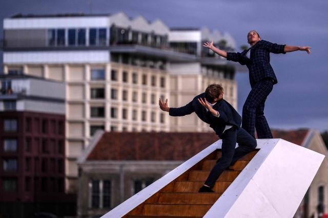 Members of the Dutch dance company Panama Pictures perform their show "The Weight of Water" over the tidal basin as part of the Festival International des Arts de Bordeaux (FAB) in Bordeaux, south-western France on October 10, 2026. (Photo by Christophe ARCHAMBAULT / AFP)