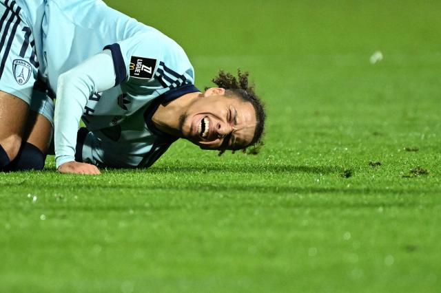 Paris FC's Algerian forward #10 Ilan Kebbal reacts on the ground  during the French L1 football match between FC Lorient and Paris FC at the Moustoir stadium, in Lorient, western France, on October 10, 2026. (Photo by Sebastien Salom-Gomis / AFP)