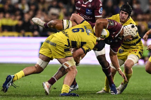 Bordeaux-Bègles' French flanker Temo Matiu is tackled by Clermont-Ferrand's French flanker Killian Tixeront during the French Top 14 rugby union match between ASM Clermont and Union Bordeaux-Begles at the Stade Marcel-Michelin in Clermont-Ferrand, on October 10, 2026. (Photo by JEFF PACHOUD / AFP)