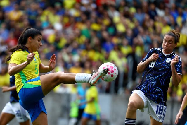 Brazil's midfielder #05 Duda Sampaio and Argentina's midfielder #18 Catalina Ongaro fight for the ball during a friendly football match between Brazil and Argentina at the Beira Rio Stadium in Porto Alegre, Brazil on October 10, 2026. (Photo by SILVIO AVILA / AFP)