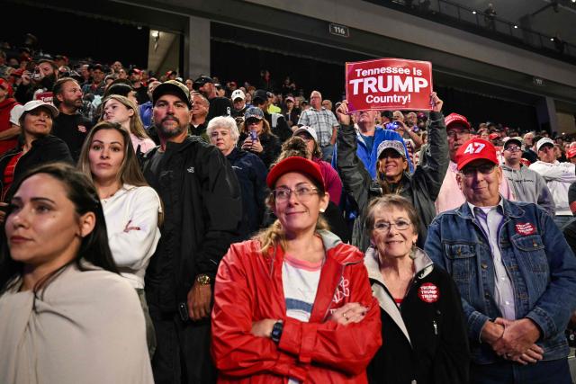 Members of the audience look on as US President Donald Trump speaks during a campaign rally at F&M Bank Arena in Clarksville, Tennessee on October 10, 2026. Trump is campaigning for Republican candidates ahead of the November 3 midterm election. (Photo by Mandel NGAN / AFP)
