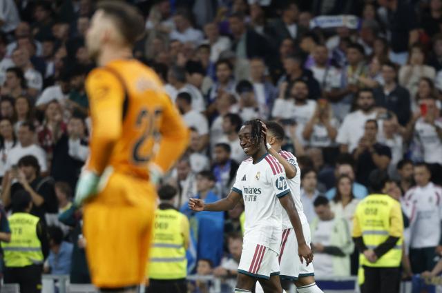 Real Madrid's Ivorian forward #25 Yan Diomande (R) celebrates scoring his team's first goal during the Spanish league football match between Real Madrid CF and Villarreal CF at the Santiago Bernabeu Stadium in Madrid on October 10, 2026. (Photo by Oscar DEL POZO / AFP)