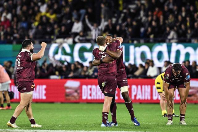 Bordeaux-Begles’ players celebrate after winning the French Top 14 rugby union match between ASM Clermont and Union Bordeaux-Begles at the Stade Marcel-Michelin in Clermont-Ferrand, on October 10, 2026. (Photo by JEFF PACHOUD / AFP)