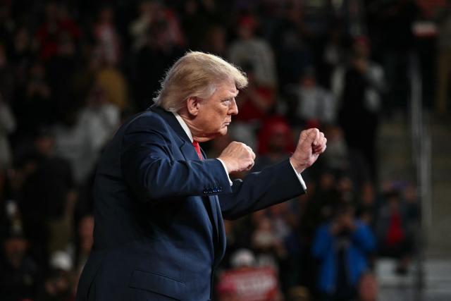 US President Donald Trump dances after concluding his remarks during a campaign rally at F&M Bank Arena in Clarksville, Tennessee on October 10, 2026. Trump is campaigning for Republican candidates ahead of the November 3 midterm election. (Photo by Mandel NGAN / AFP)