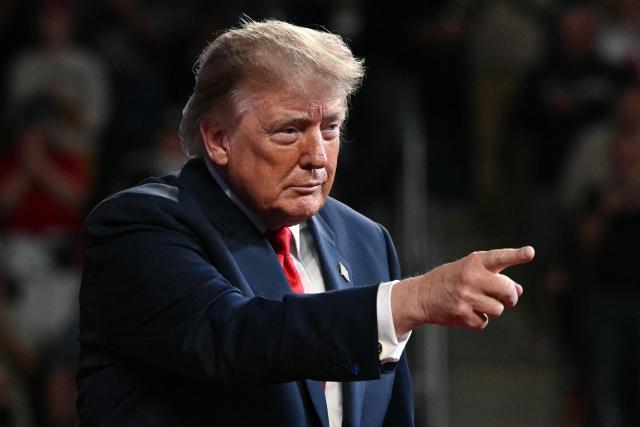 US President Donald Trump gestures after concluding his remarks during a campaign rally at F&M Bank Arena in Clarksville, Tennessee on October 10, 2026. Trump is campaigning for Republican candidates ahead of the November 3 midterm election. (Photo by Mandel NGAN / AFP)