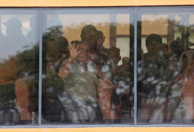 People look out from the windows of a ferry carrying evacuees from the community of Yelapa to the facilities of the 12th Naval Zone in Puerto Vallarta, Jalisco state, Mexico, on October 10, 2026, ahead of the potential impact of Hurricane Simon. Hurricane Simon strengthened into a powerful Category 4 storm as it moved toward Mexico's west coast, where it was expected to make landfall late on October 10 or early on October 11. (Photo by ULISES RUIZ / AFP)