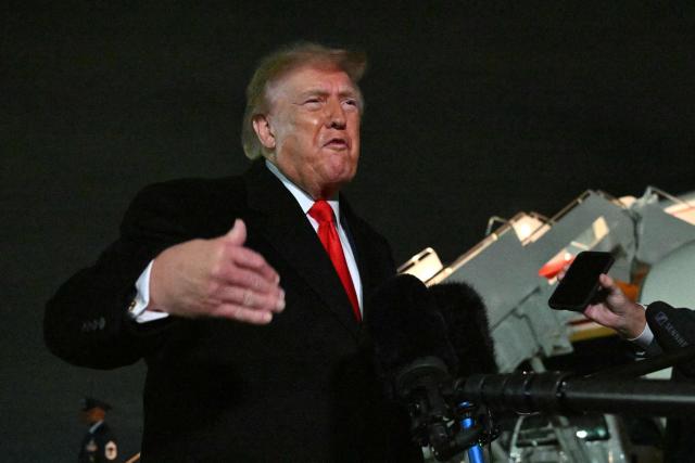 US President Donald Trump speaks with reporters upon his arrival to Joint Base Andrews, Maryland on October 10, 2026. President Trump is returning from Tennessee where he spoke at a campaign rally. (Photo by Mandel NGAN / AFP)