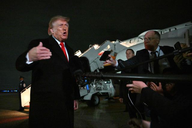US President Donald Trump speaks with reporters upon his arrival to Joint Base Andrews, Maryland on October 10, 2026. President Trump is returning from Tennessee where he spoke at a campaign rally. (Photo by Mandel NGAN / AFP)