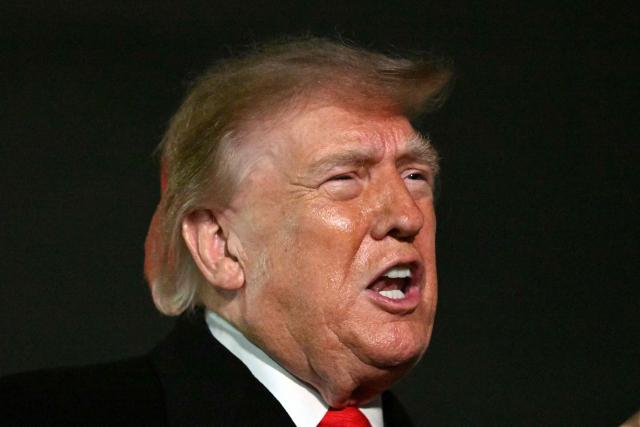 US President Donald Trump speaks with reporters upon his arrival to Joint Base Andrews, Maryland on October 10, 2026. President Trump is returning from Tennessee where he spoke at a campaign rally. (Photo by Mandel NGAN / AFP)