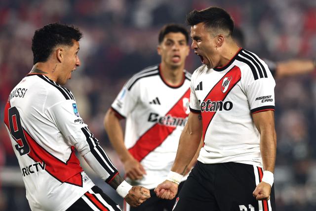 River Plate's defender #21 Marcos Acuna (R) celebrates scoring his team's first goal with forward #09 Sebastian Driussi during the Argentine Professional League 2026 Clausura tournament football match between River Plate and Estudiantes de Rio Cuarto at the Mas Monumental stadium in Buenos Aires on October 10, 2026. (Photo by Alejandro PAGNI / AFP)