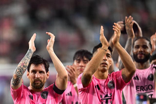 Inter Miami's Argentine forward #10 Lionel Messi (L) and Uruguayan forward #09 Luis Suarez applaud to the crowd at the end of a Major League Soccer (MLS) regular season football match between Inter Miami CF and DC United at Nu Stadium in Miami, Florida, on October 10, 2026. (Photo by CHANDAN KHANNA / AFP)